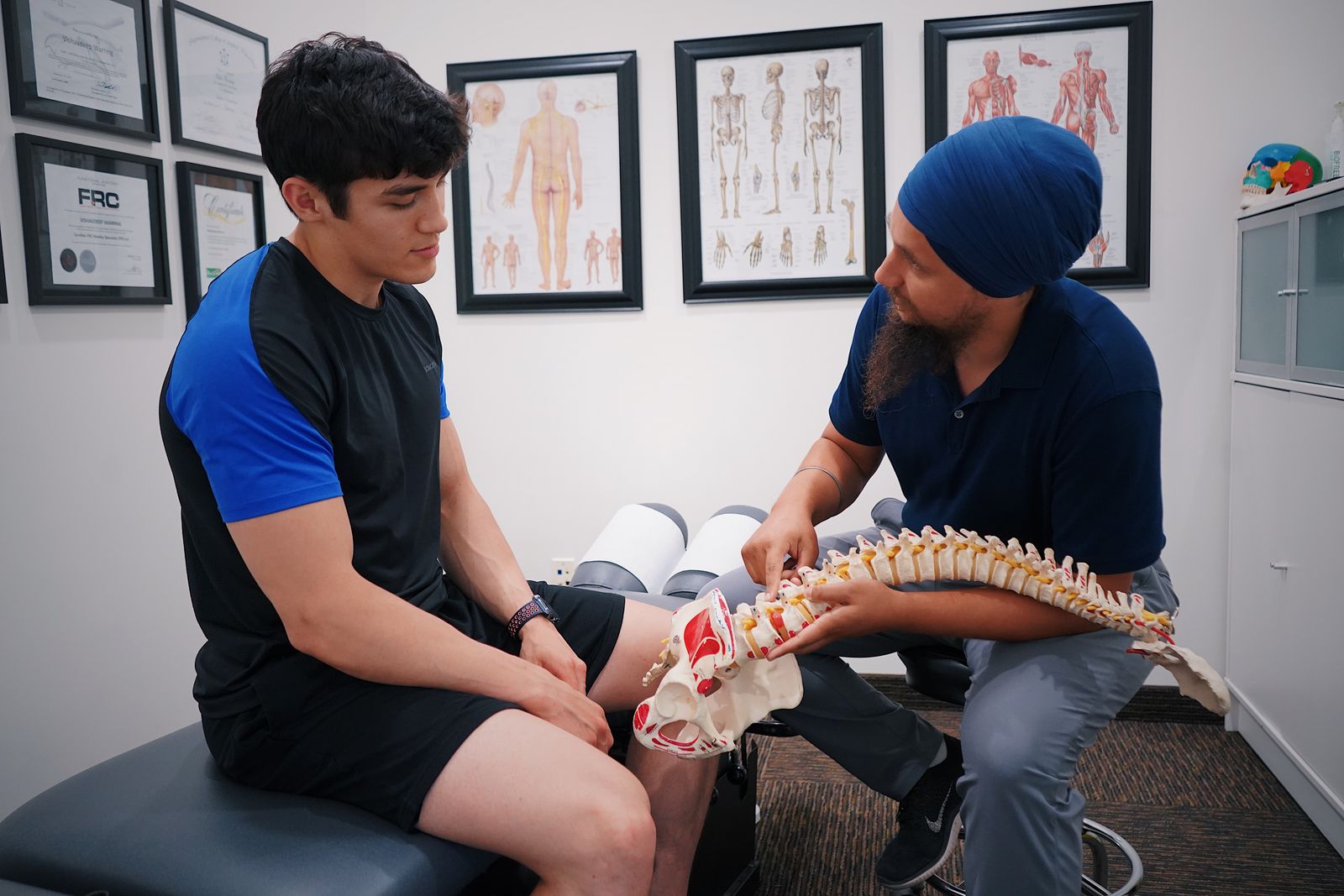 Indian doctor consulting thoughtfully with a patient